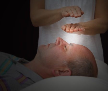 31971642 - Healer Sensing Aura Levels Over Third Eye Chakra